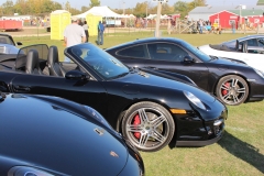 A line-up of black Porsches