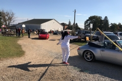 SEM Community Chair Chrissy greeting the incoming cars